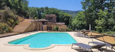 a swimming pool in front of a house at Magnifique Mas avec Piscine - La Bergerie du Razès in Alet-les-Bains