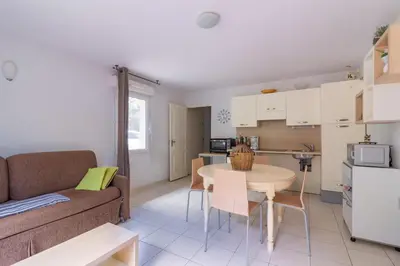 a living room with a couch and a table at Douceur de Jouarres - Avec piscine in Azille