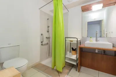 a bathroom with a toilet and a sink and a shower at Douceur de Jouarres - Avec piscine in Azille