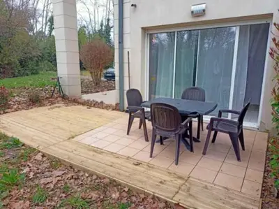a patio with a table and chairs on it at Douceur de Jouarres - Avec piscine in Azille