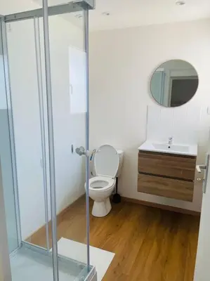 a bathroom with a toilet and a sink at Studio Charles de Gaulle II in Castres