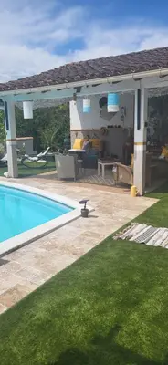 a backyard with a pool and a pergola at La maison d'Aude in Quillan