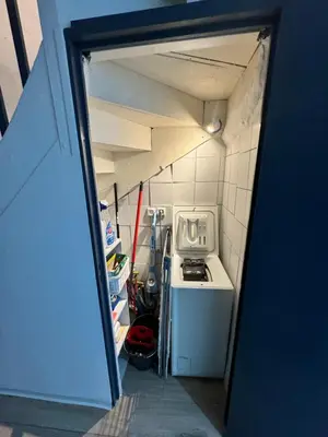 a small kitchen with a sink and a stove at Charmante maison de village in Bram