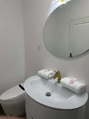 a bathroom with a white sink and a mirror at Studio Cosy du Cloitre in Narbonne