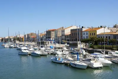 a bunch of boats are docked in a harbor at Le Mieukerien - Réserve africaine 15 mn - Plage 200 m in Port-la-Nouvelle