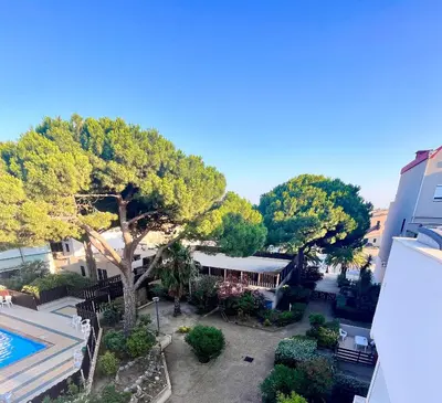 an aerial view of a resort with a pool and trees at L'appart D79 in Gruissan