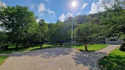 a view of a park with a fountain at Dortoir Gîte d'étapes 