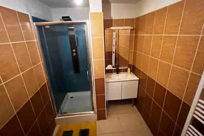 a bathroom with a shower and a sink at T3 6 couchages grands buffets et plages in Narbonne