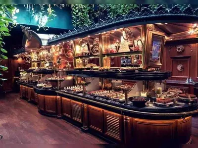 a restaurant with a buffet of food on display at T3 6 couchages grands buffets et plages in Narbonne