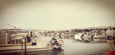 a group of boats docked in a harbor at Appartement 600M de la plage in Port-la-Nouvelle