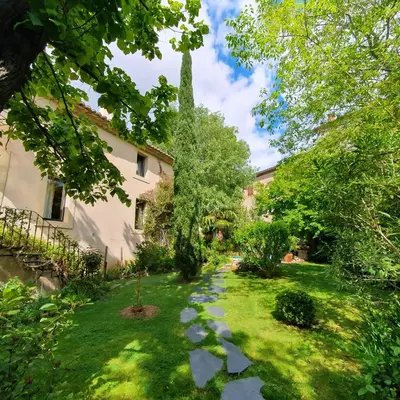 a garden in front of a house at Le Clos Ste Anne in Bizanet