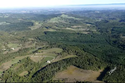 an aerial view of a forested area with a golf course at Bulle perchée in Sonnac-sur-lʼHers