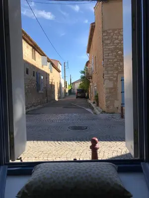 a view of an empty street from a window at Maison Corbieres in Peyriac-de-Mer