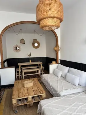 a living room with a couch and a table at La maison de la gare in Carcassonne
