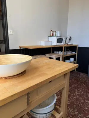 a kitchen with a counter with a bowl on a table at La maison de la gare in Carcassonne