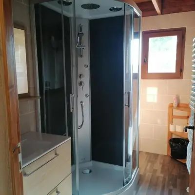a shower with a glass door in a bathroom at Chalet 