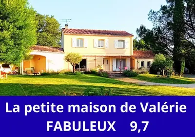a house with the words la petite mission de vallez at La petite maison de Valérie proche château de la Rode, du Domaine de Flore et du Lac Saint Ferréol in Lempaut
