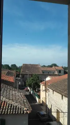 a view of a city with buildings and roofs at Maison Pelissier Bed and Breakfast with swemming pool in Cuxac-dʼAude