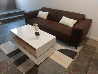 a living room with a couch and a coffee table at La Parenthèse in Moussan
