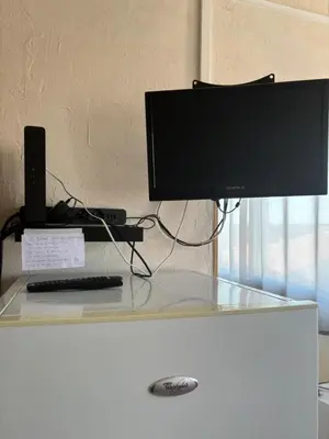 a computer monitor sitting on top of a desk at L'Arbousier in Port-la-Nouvelle
