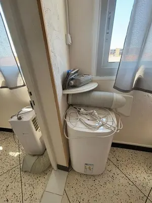 a bathroom with a toilet and a window at L'Arbousier in Port-la-Nouvelle