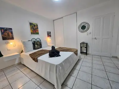 a bedroom with a large bed in a room at La Casa D'Eole YourHostHelper in Narbonne