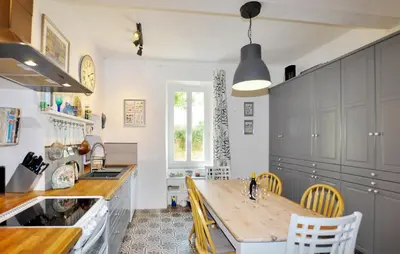 a kitchen with a table and chairs in it at Gorgeous Home In Thézan-Des-Corbières in Thézan-des-Corbières
