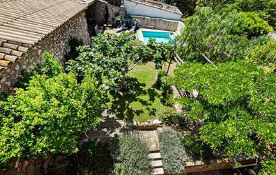 an overhead view of a garden with trees and a house at Gorgeous Home In Thézan-Des-Corbières in Thézan-des-Corbières