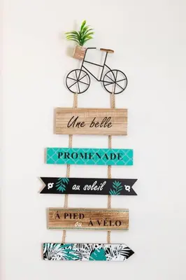 a wooden sign with a bike and some signs at Duplex moderne centre Narbonne in Narbonne