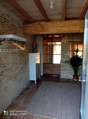 a kitchen with a white refrigerator in a room at Maison Lauraguaise parking grand jardin wifi in Villenouvelle