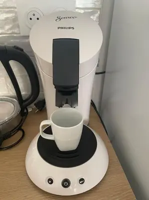 a coffee maker with a cup on top of it at Le Bastide l 2 chambres l Rez-de-chaussée l Terrasse l Clim in Sémalens