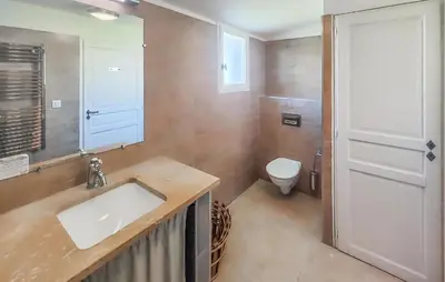 a bathroom with a sink and a toilet at Pet Friendly Home In Saint Laurent De La Ca in Saint-Laurent-de-la-Cabrerisse