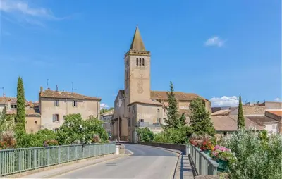 a street in a town with a church at Pet Friendly Home In Saint Laurent De La Ca in Saint-Laurent-de-la-Cabrerisse