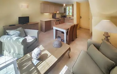 a living room with a couch and a table at Pet Friendly Home In Saint Laurent De La Ca in Saint-Laurent-de-la-Cabrerisse