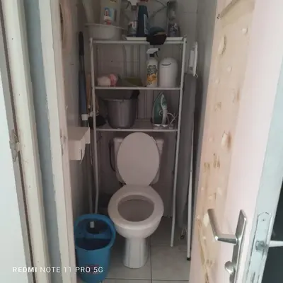 a bathroom with a toilet in a small room at Charmant T3 de 65 m2 in Port-la-Nouvelle