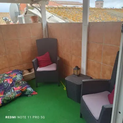 a room with two chairs and a table at Charmant T3 de 65 m2 in Port-la-Nouvelle
