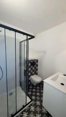 a bathroom with a toilet and a sink at La Gruissanaise in Gruissan
