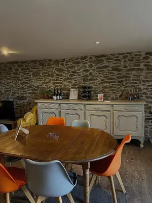 a dining room with a wooden table and chairs at Chez Pauline & Vincent Côté Canal in Carcassonne