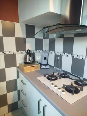 a kitchen with a stove top oven in a kitchen at Chez Pauline & Vincent Côté Canal in Carcassonne