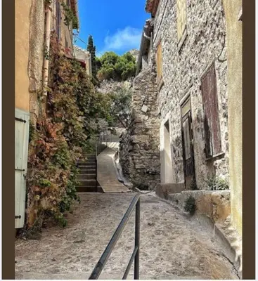 an alley with stairs leading down a stone building at Appartement du bonheur- 6 personnes in Gruissan