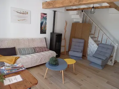 a living room with a couch and two chairs at Maison indépendante à la ferme in Palleville