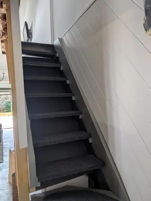 an empty stairway in a room with at Studio indépendant tout équipé in Saint-Marcel