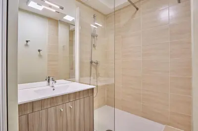 a bathroom with a sink and a shower at Résidence Odalys Côté Canal in Sallèles-dʼAude
