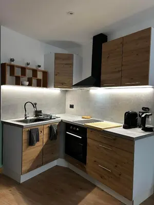 a kitchen with a sink and a stove at Studio les Rosiers in Quillan