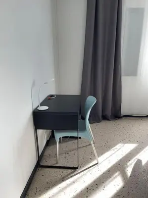 a black desk and a chair in a room at Maison 2 chambres 3 lits 4 couchages et extérieur in Villefranche-de-Lauragais