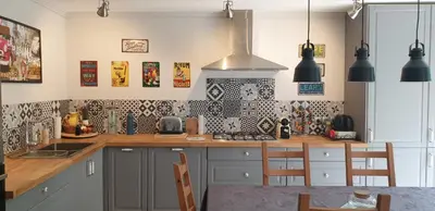 a kitchen with a counter and a stove top oven at LA PETITE BICOQUE au fond du jardin in Quillan
