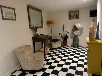 a room with a black and white checkered floor at La Barbacane de Cascastel-des-Corbières in Cascastel-des-Corbières
