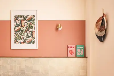 a room with a wall with a picture and a shelf at Appart BonaVita Narbona in Narbonne