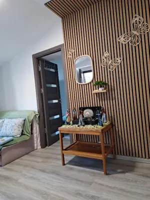 a room with a table and a bed and a mirror at Galamus Bonheur - L'art de choisir in Saint-Paul-de-Fenouillet