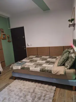 a bedroom with a large bed with a wooden headboard at Galamus Bonheur - L'art de choisir in Saint-Paul-de-Fenouillet